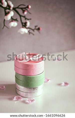 Set of gift boxes in pastel shades with delicate flowers. Female greeting card concept. Present for Mom's Day and International Women's Day