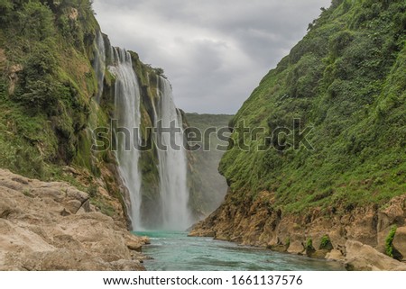 Green Background Scenic view of spectacular Tamul Waterfall, Tampaon River, Huasteca Potosina, Mexico