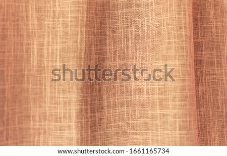 background photo of a light brown vertical wavy linen curtain with a vibrant pattern