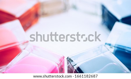 Set of nail polishes. The lower parts of glass bottles of different colors
