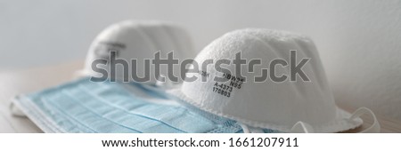 Corona virus prevetion face mask protection N95 masks and medical surgical masks selection panoramic banner. Royalty-Free Stock Photo #1661207911