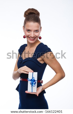 Young woman passes a gift wrapped in red paper, isolated on white 