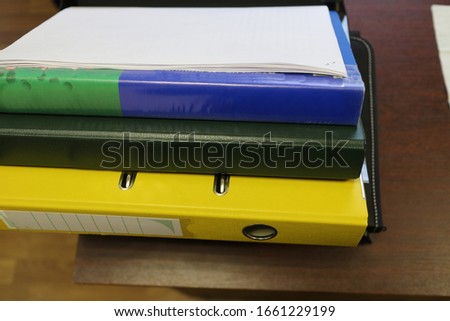multi-colored office folders on the table