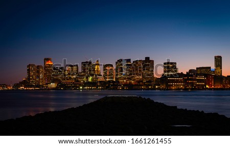 Night Cityscape Boston Skyline and Sea Reflections from LoPresti Park over Mystic River in Boston, Massachusetts
