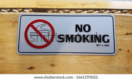 No smoking sign on Old wood wall background