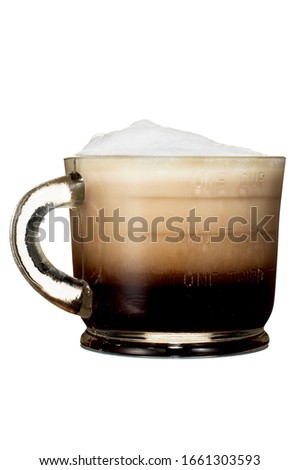 Cappuccino with frothed milk on white background