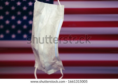 Mask on the background of the us flag as the fight against coronavirus in America