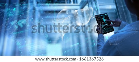 Medicine woman doctor touching digital medical record tablet with Liver. AR of healthcare and network connection on hologram modern Ui forTreatment and diagnostics of liver Royalty-Free Stock Photo #1661367526