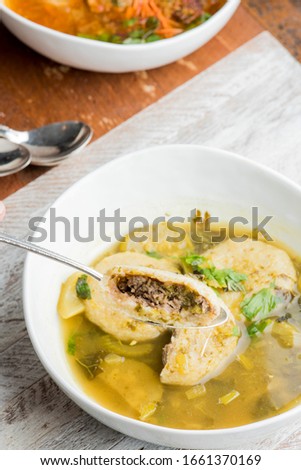 Matzo Ball Soup. Classic soup made with chicken or vegetable stock and matzo balls dumplings. Classic American Restaurant or Diner favorite. Soup made with chicken broth, noodles celery and carrots.