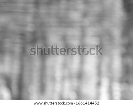 Blurred light gray background with bokeh