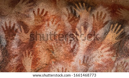 Prehistoric hand paintings at the Cave of Hands (Spanish: Cueva de Las Manos ) in Santa Cruz Province, Patagonia, Argentina. The art in the cave dates from 13,000 to 9,000 years ago.