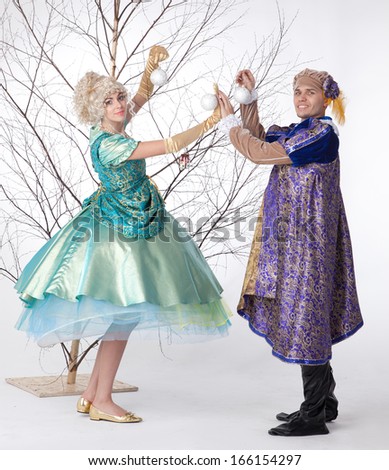 Princess and prince decorating tree