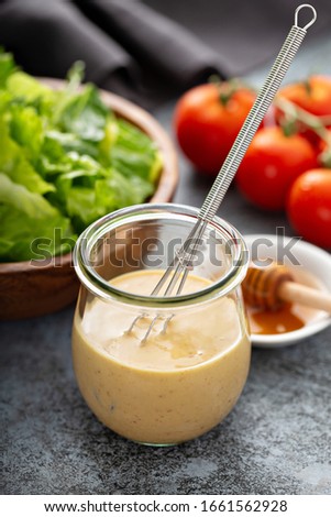 Homemade creamy honey mustard sauce in a glass jar Royalty-Free Stock Photo #1661562928