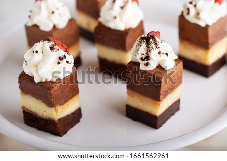 Bite sized dessert, three chocolate layer cake Royalty-Free Stock Photo #1661562961