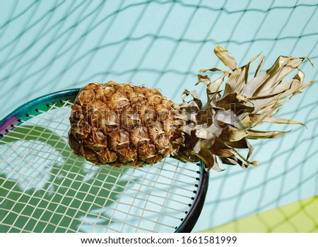 Tropical pineapple on a blue-green background. Against the background of shadow waves. The concept of summer, fitness, diet, healthy eating.