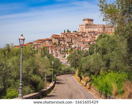 Sermoneta, famous small village in Latina province. Winding road to ancient town, with Caetani castle on the top, and old medieval houses around. Beautiful Italian landscape. Travel, tourism concept.