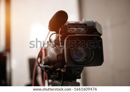 Television camera lens, Film of Video movie recording films shooting of grand opening in conference hall Live streming for presentation with bokeh light background. Media Production Concept