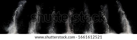 white powder explosion cloud against black background.White dust particles splash . Royalty-Free Stock Photo #1661612521