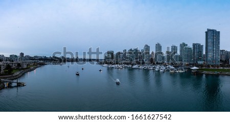 Downtown Vancouver, British Columbia, Canada. Beautiful Aerial Panoramic View of Modern City Buildings in False Creek during a colorful blue hour Sunset. Panorama