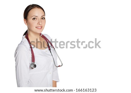 Young girl in a medical coat with a stethoscope smiling