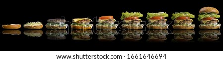 Process making of burger, step by step isolated on black background. Burger wide banner. Split burger. Burger divided in parts. Royalty-Free Stock Photo #1661646694