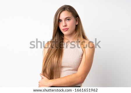 Portrait of beautiful teenager blonde girl over isolated white background