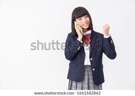 asian girl student who talks on the telephone,School uniform,