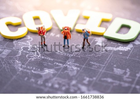 Miniature people: Covic , group backpacker with copy space using as background , business , trip travel concept.