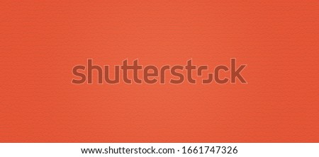 close up of artificial leather texture background, orange color tone - can be used as background