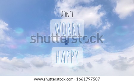 Don’t worry Be happy handwriting word on blue sky background