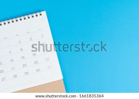 Calendar on blue background with copy space and blank space to put month and year using as reminder, plan and appointment concept.