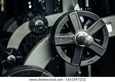 Gym weight plates on holder close up Royalty-Free Stock Photo #1661847232