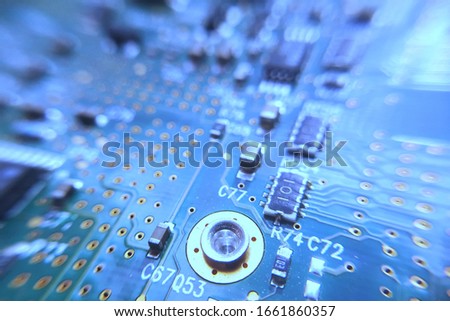 Closeup blue computer PCB board. Macro picture of blue printed circuit board - PCB.