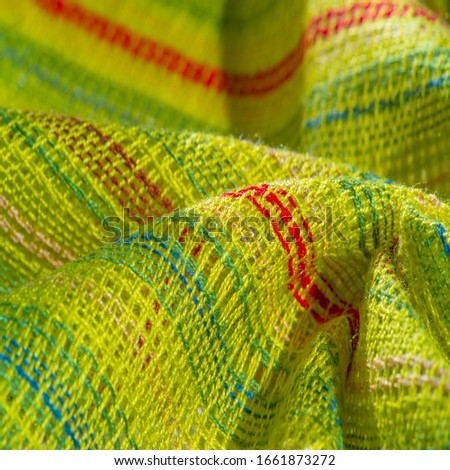 texture, background, pattern, postcard, fabric light green striped red-blue yellow lines, very light elastic knitwear, light shine