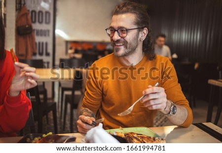 Young man in Fast Food Restaurant	
