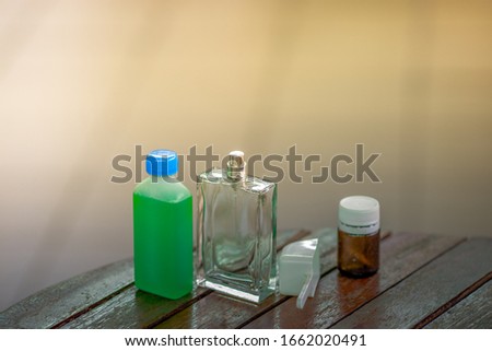 Close-up background of empty blurred bottles of many sizes, placed on a wooden table or a small shopping cart, business concept