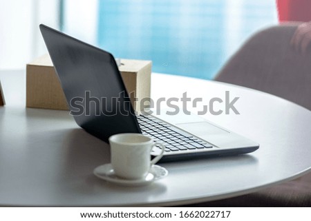 Laptop with a cup of coffee on the desk on the workplace