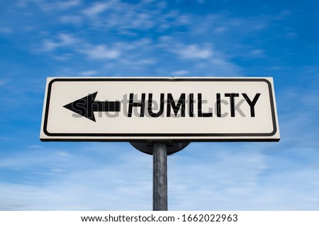 Humility road sign, arrow on blue sky background. One way blank road sign with copy space. Arrow on a pole pointing in one direction.
