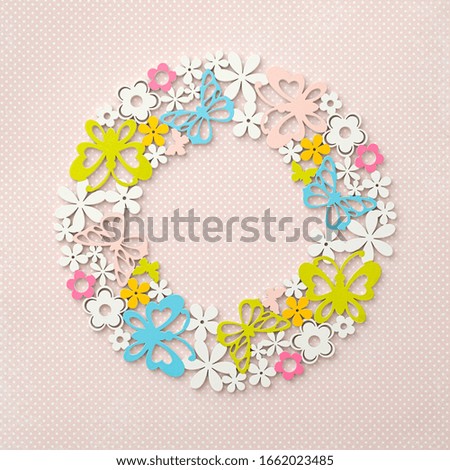 Meadow, summer and spring flowers and butterflies. Wreath of flowers. Spring and summer motives.Pink, green and blue wreath on pink background. Pastel.

Top view, flat lay, copy space.