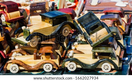 Closeup of multicolored wooden toy cars in view