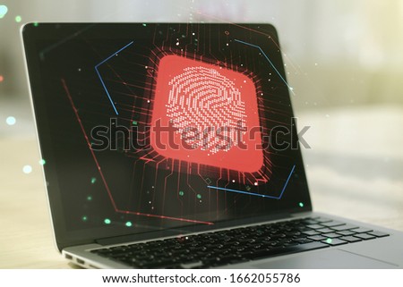 Double exposure of abstract creative fingerprint hologram on laptop background, research and development concept
