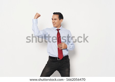 Man in bright shirt red tie business director of the company