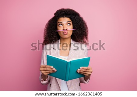 Photo of funny childish dark skin student lady hold copybook book not reading playing pen make fake mustache wear checkered blazer isolated pastel pink color background