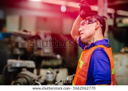 Tired worker, headache hot weather over heat unhealthy engineer working in heavy industry factory. Royalty-Free Stock Photo #1662062770