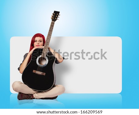 young woman holding a classic guitar against a banner
