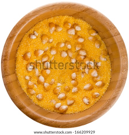 cornmeal maize flour surface in wooden bowl dish isolated on white background 