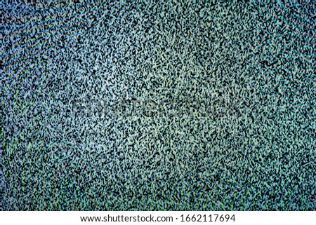Monochrome noise on a television screen as an abstract background