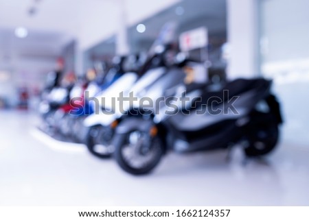 Abstract blur motorcycle on showroom sales area in Asia