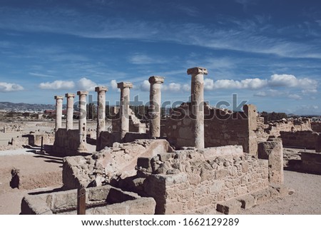 Ancient ruins of Kourion city near Pathos and Limassol, Cyprus. Row of columns under blue sky. Travel outdoor background