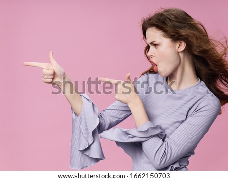 young woman in blue sweater isolated background
